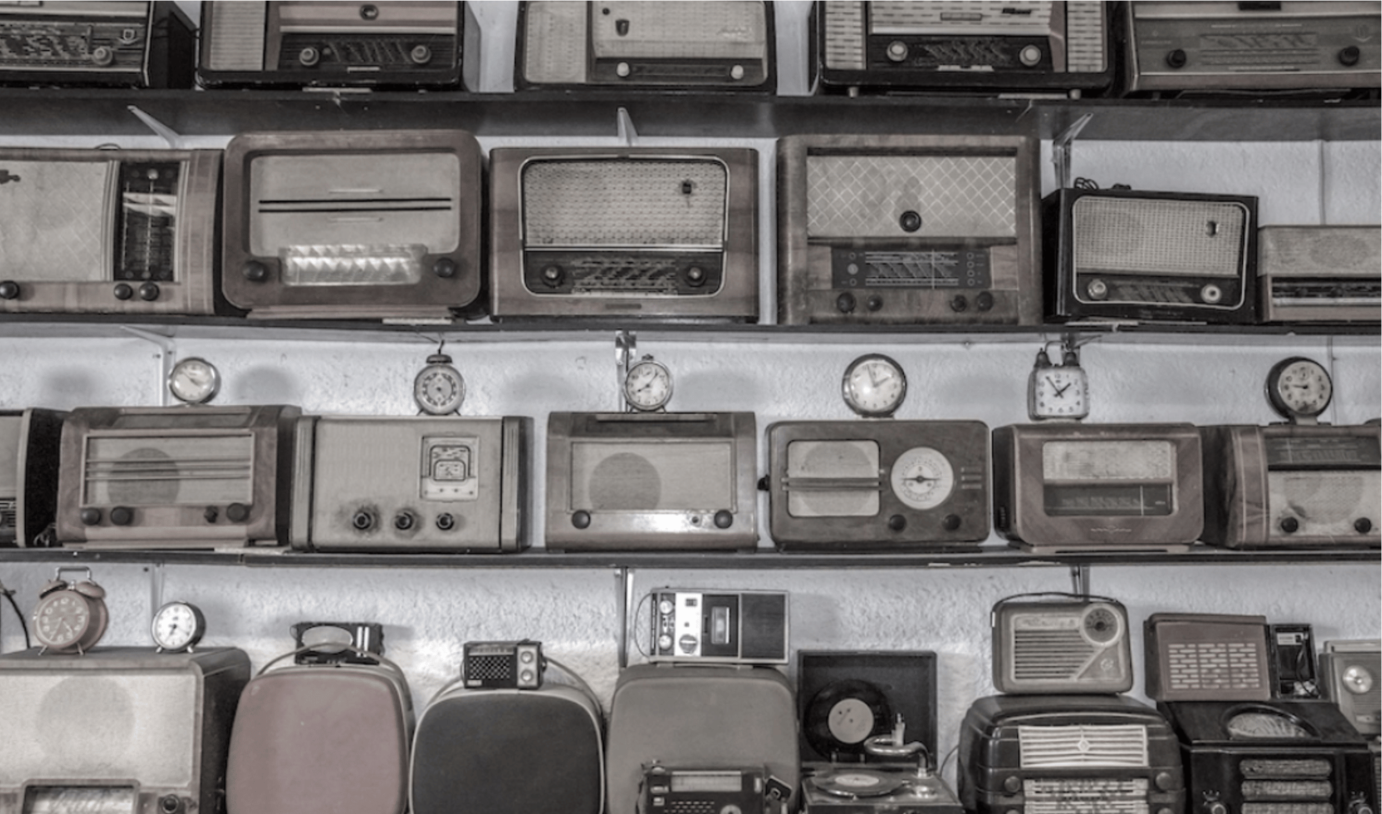 typewriters and clocks on a table