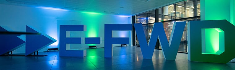 E-FWD logo against blue and green lights