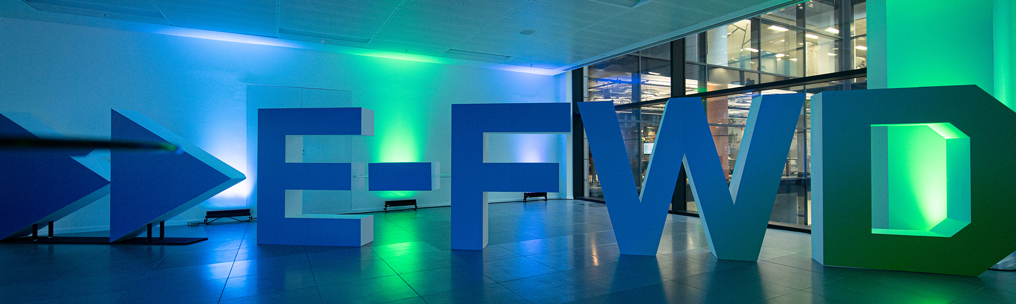 E-FWD logo against blue and green lights